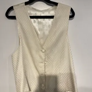cream pattern vest